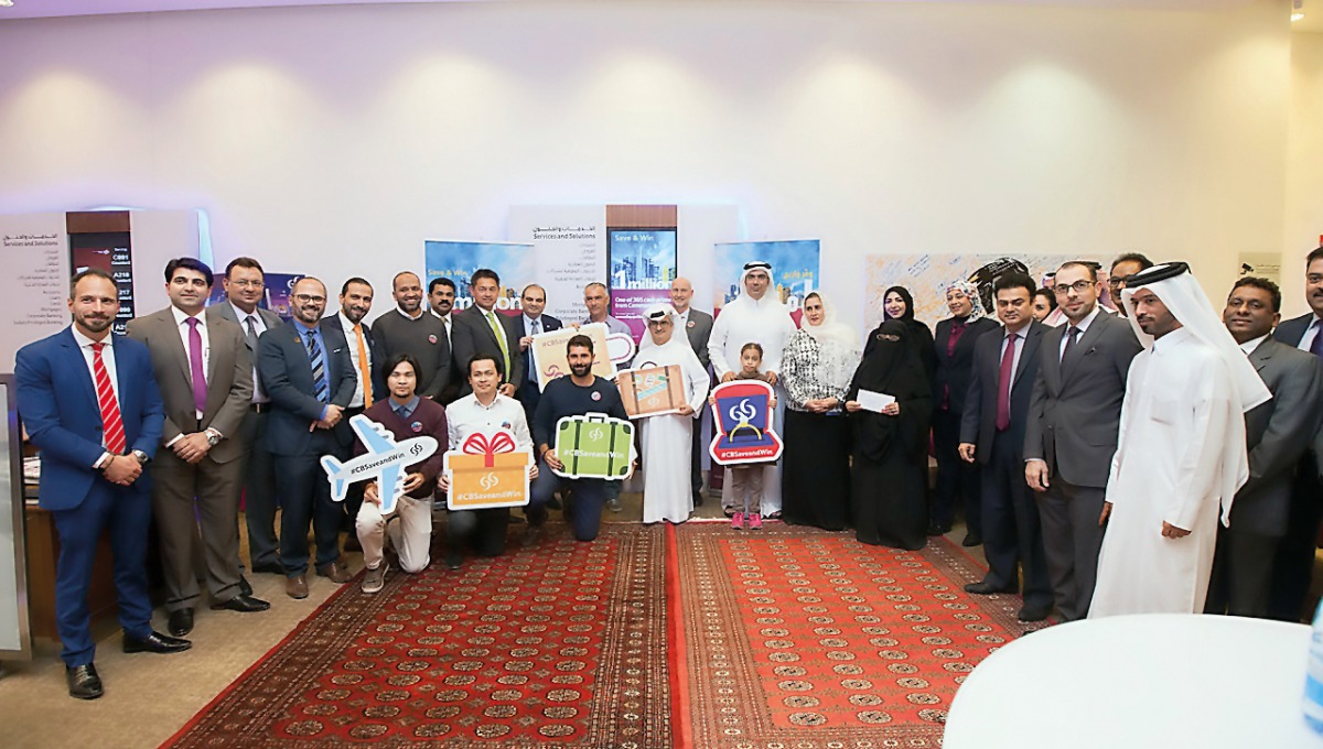 Commercial Bank officials with the fourth monthly winners of the bank’s ‘Save & Win’ campaign.