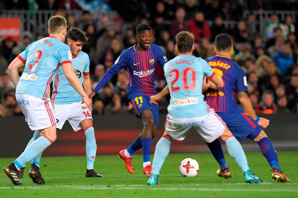 Barcelona's French forward Ousmane Dembele (C) vies with Celta Vigo's Spanish defender Sergi Gomez during the Spanish Copa del Rey (King's Cup) round of 16 second leg football match FC Barcelona vs RC Celta de Vigo at the Camp Nou stadium in Barcelona on 