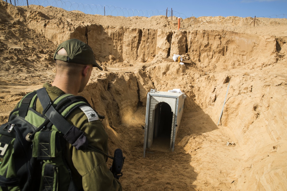 A picture taken 18 January 2018 from the Israeli side of the border with the Gaza Strip shows a Israeli army officer walking near the entrance of a tunnel, that Israel says was dug by the Islamic Jihad group, leading from the Palestinian enclave into Isra