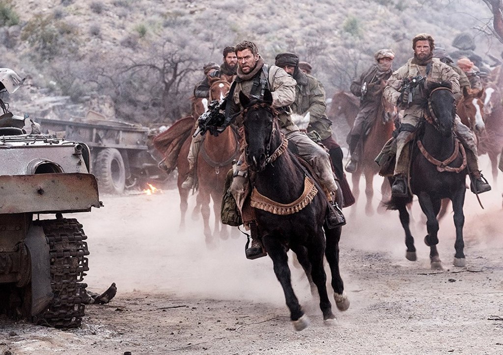 A still of actor Chris Hemsworth (C) from the movie 12 Strong.