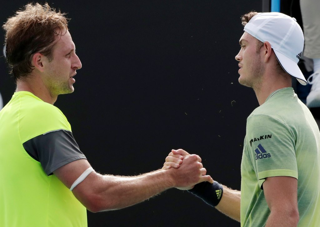 Tennys Sandgren of the USA (L) and Maximilian Marterer of Germany (R) greet each other at the net after their round three match at the Australian Open Grand Slam tennis tournament in Melbourne, Australia, 20 January 2018. Sandgren won the match. EPA/MARK 