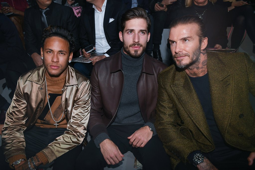 razilian soccer player Neymar Jr (L), German PSG's goalkeeper Kevin Trapp and British former soccer player David Beckham (R) attend the presentation of the Fall/Winter 2018/19 Men's collection by British designer Kim Jones for Louis Vuitton fashion house 