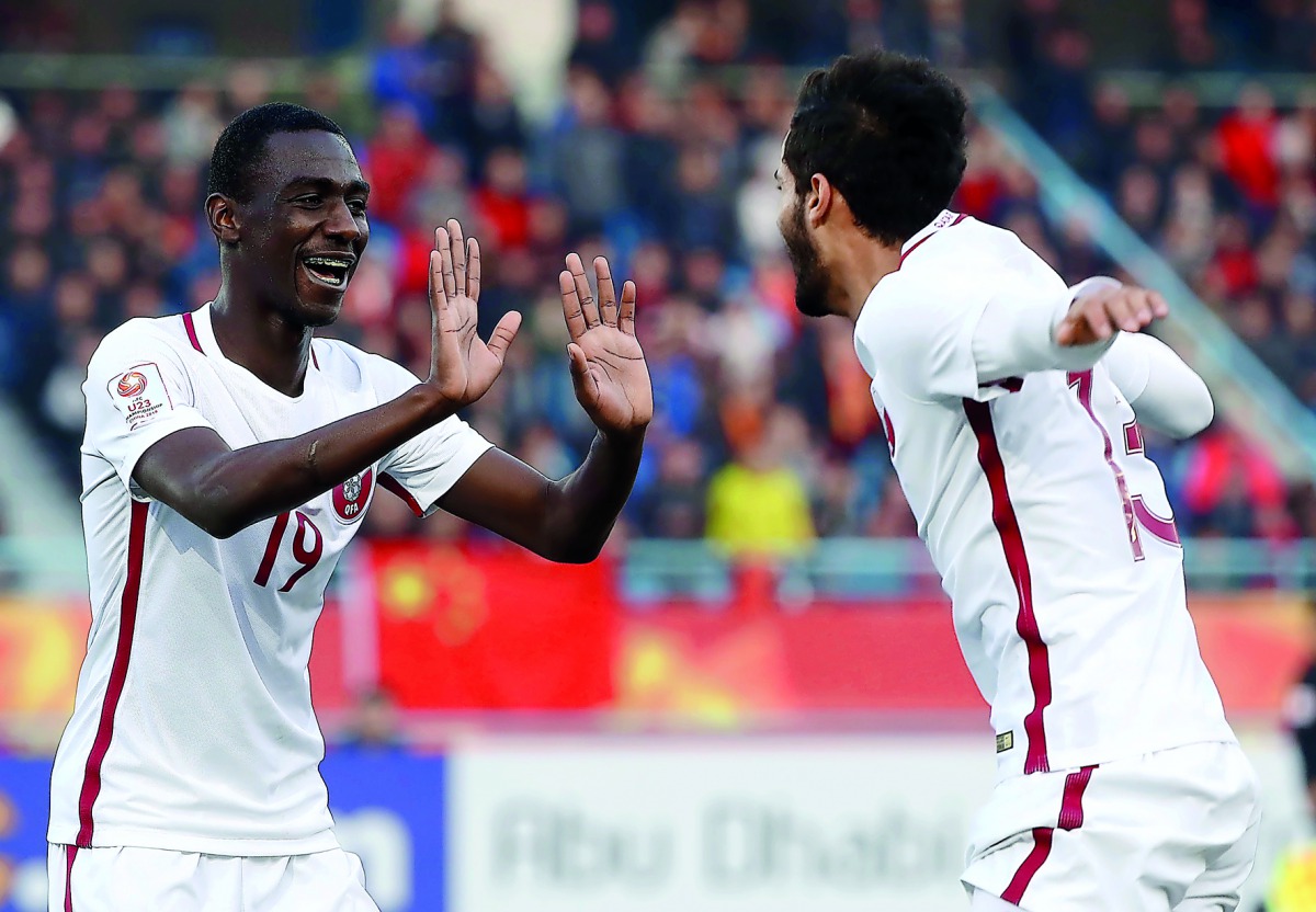 Qatar’s star striker Almoez Ali (L) celebrates scoring a goal at the AFC U-23 Asian Cup.