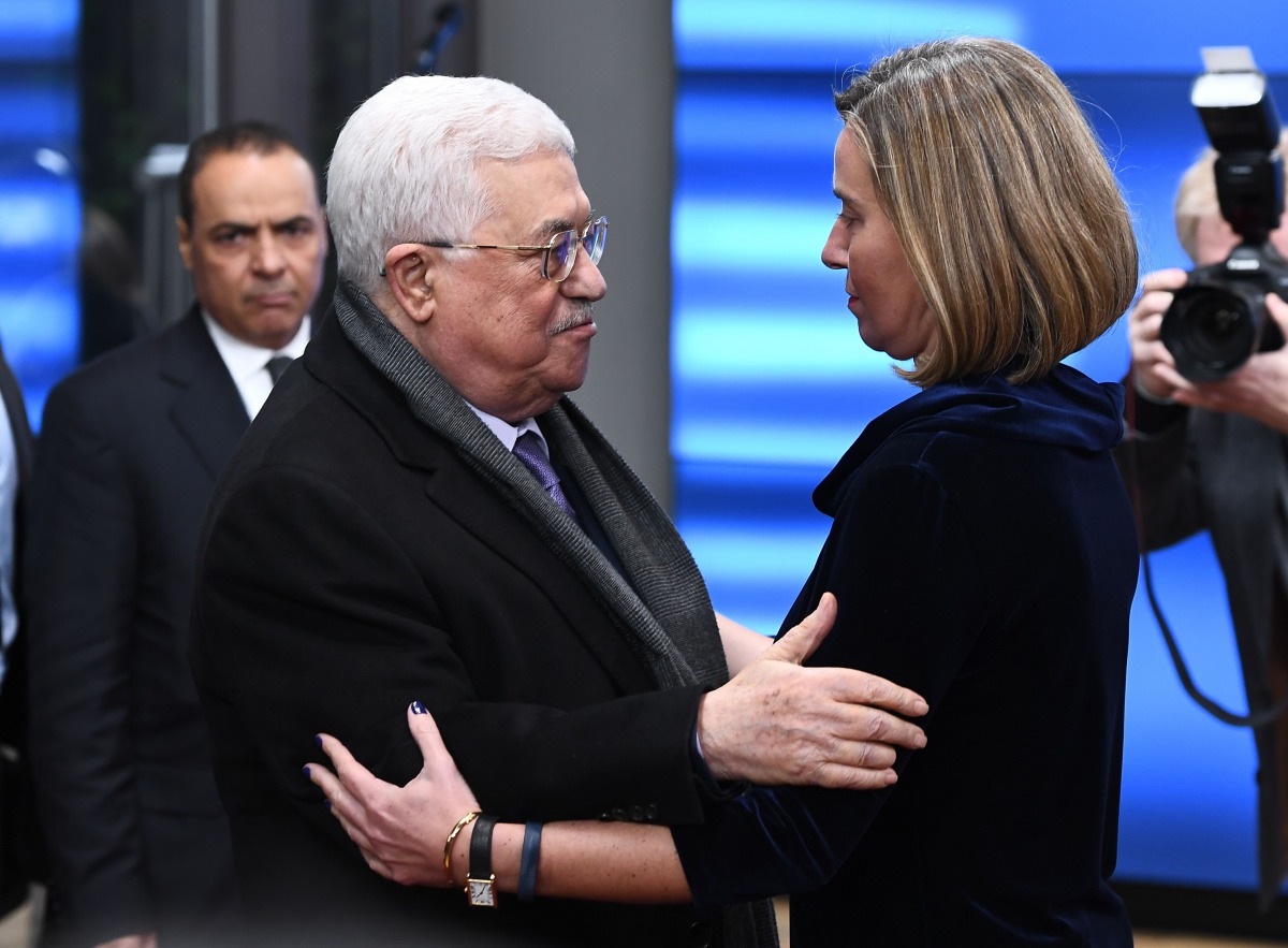 Palestinian President Mahmud Abbas (L) is welcomed by EU foreign policy chief Federica Mogherini prior to attend a EU foreign affairs council at the European Council in Brussels, January 22, 2018. AFP / Emmanuel Dunand