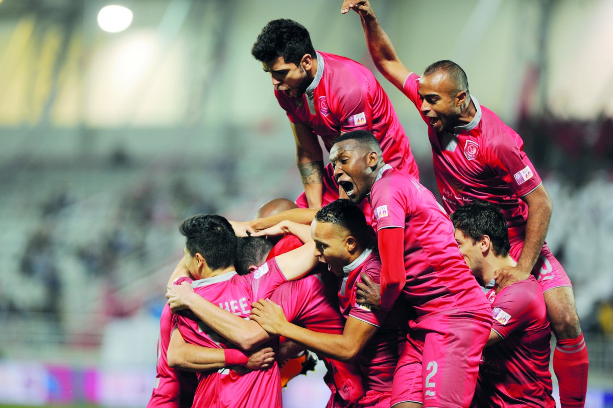 Al Rayyan players celebrate after scoring against Al Duhail during their QNB Stars League match against Al Duhai at Al Duhail Stadium yesterday. The thrilling encounter ended in a three-all draw.