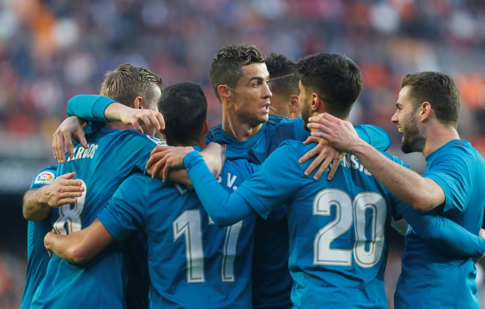 Real Madrid’s Toni Kroos celebrates scoring their fourth goal with teammates REUTERS/Heino Kalis