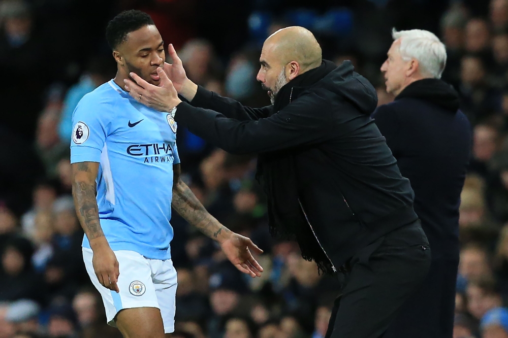Manchester City's Spanish manager Pep Guardiola (R) gestures to Manchester City's English midfielder Raheem Sterling (L) during the English Premier League football match between Manchester City and West Bromwich Albion at the Etihad Stadium in Manchester,