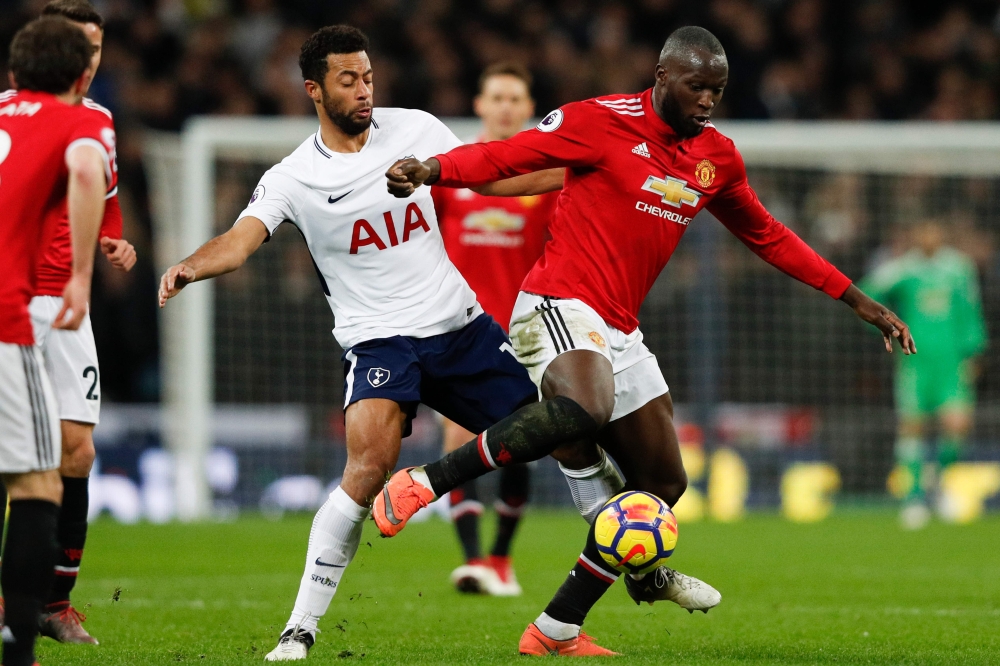 Tottenham Hotspur's Belgian midfielder Mousa Dembele (L) tackles Manchester United's Belgian striker Romelu Lukaku (R) during the English Premier League football match between Tottenham Hotspur and Manchester United at Wembley Stadium in London, on Januar