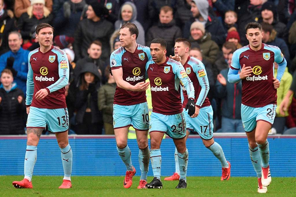 Burnley players celebrate after Burnley's Icelandic midfielder Johann Berg Gudmundsson scored their first goal to equalise 1-1 during the English Premier League football match between Burnley and Manchester City at Turf Moor in Burnley, north west England