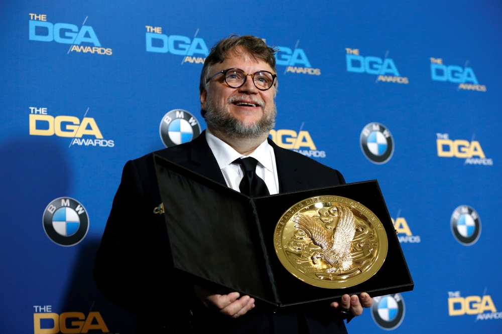 Director Guillermo del Toro holds his award for Outstanding Directorial Achievement in Feature Film for 