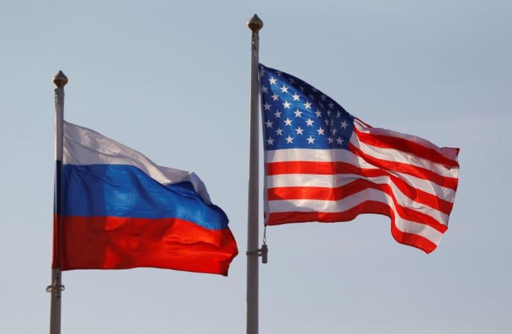 File photo of the National flags of Russia and the US fly at Vnukovo International Airport in Moscow, Russia April 11, 2017. REUTERS/Maxim Shemetov