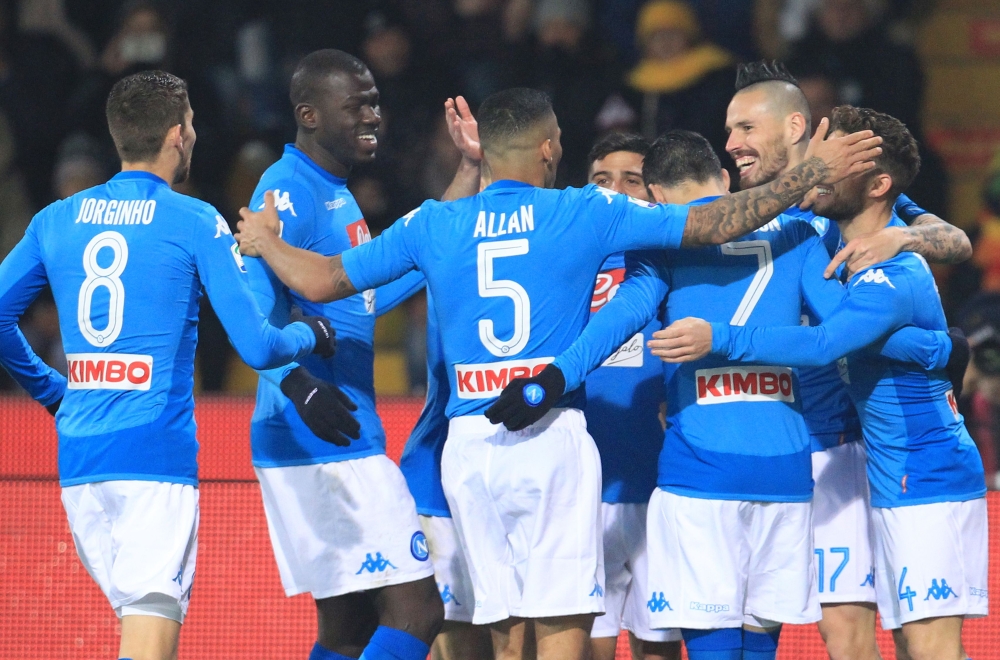 Napoli's Slovakian midfielder Marek Hamsik (2ndR) celebrates with teammates after scoring a goal during the Italian Serie A football match SSC Napoli vs Benevento Calcio at Ciro Vigorito Stadium on February 4, 2018. / AFP / CARLO HERMANN
 