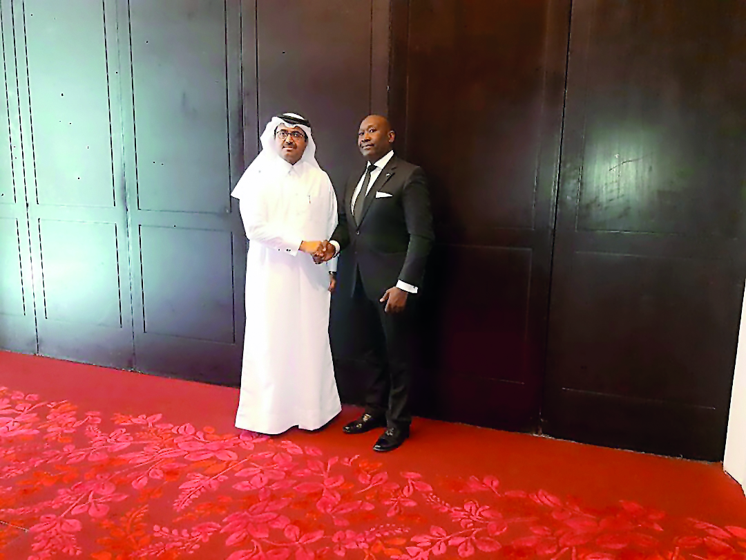 H E Dr Mohammed bin Saleh Al Sada (left),Minister of Energy and Industry,  shaking hands with the visiting Minister of Energy of Sierra Leone Henry Olufemi Macauley, in Doha, yesterday.  