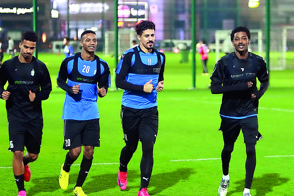 Al Sadd players in action during a training session on Sunday.