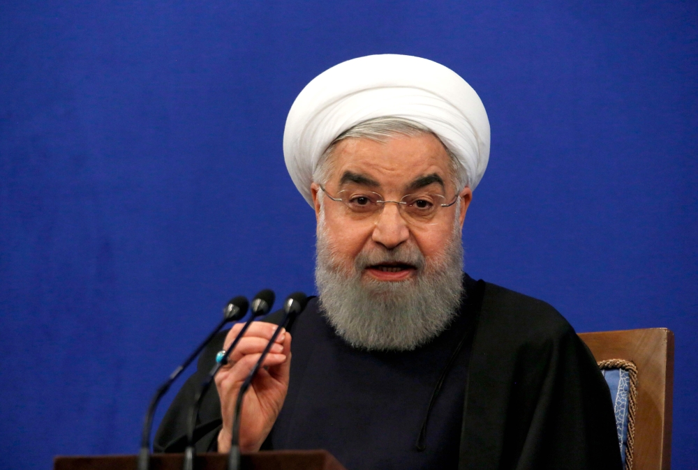 Iranian President Hassan Rouhani speaks during a press conference in Tehran on February 6, 2018, to mark the 39th anniversary of Iran's Islamic revolution. / AFP / ATTA KENARE
