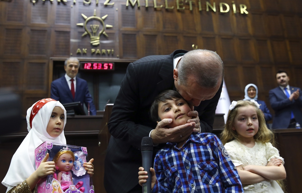Children read poem near President of Turkey and Leader of the Justice and Development Party (AK Party) Recep Tayyip Erdogan, after AK Party parliamentary group meeting at the Grand National Assembly of Turkey (TBMM) in Ankara, Turkey on February 06, 2018.