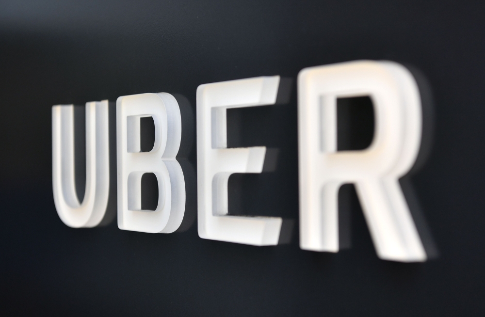 The Uber logo is seen outside the Uber Corporate Headquarters building in San Francisco, California on February 05, 2018.  AFP / JOSH EDELSON
