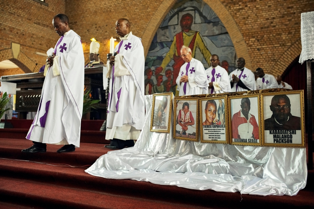 Priests hold a mass for citizens killed in recent protests, at the Cathedral of Our Lady of Congo in Kinshasa, Democratic Republic of Congo February 9, 2018. Reuters/Robert Carrubba
