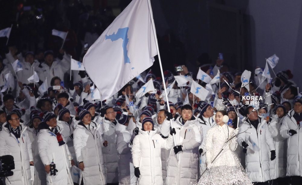Hwang Chung Gum and Won Yunjong of Korea carry the unification flag during the opening ceremony. Reuters/Kim Kyung-Hoon