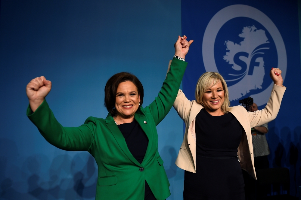 Newly elected Sinn Fein President Mary Lou McDonald (L) and new Deputy Michelle O'Neill celebrate on stage with party members at a special party conference, at which Gerry Adams formally stepped down as President, in Dublin, Ireland, February 10, 2018. RE