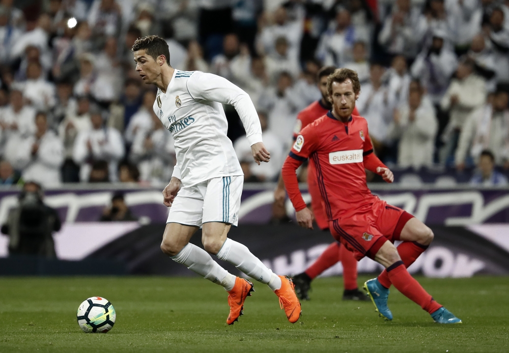 Cristiano Ronaldo (L) of Real Madrid in action against David Zurutuza (R) of Real Sociedad during the La Liga match between Real Madrid and Real Sociedad at the Santiago Bernabeu Stadium in Madrid, Spain on February 10, 2018. ( Burak Akbulut - Anadolu Age