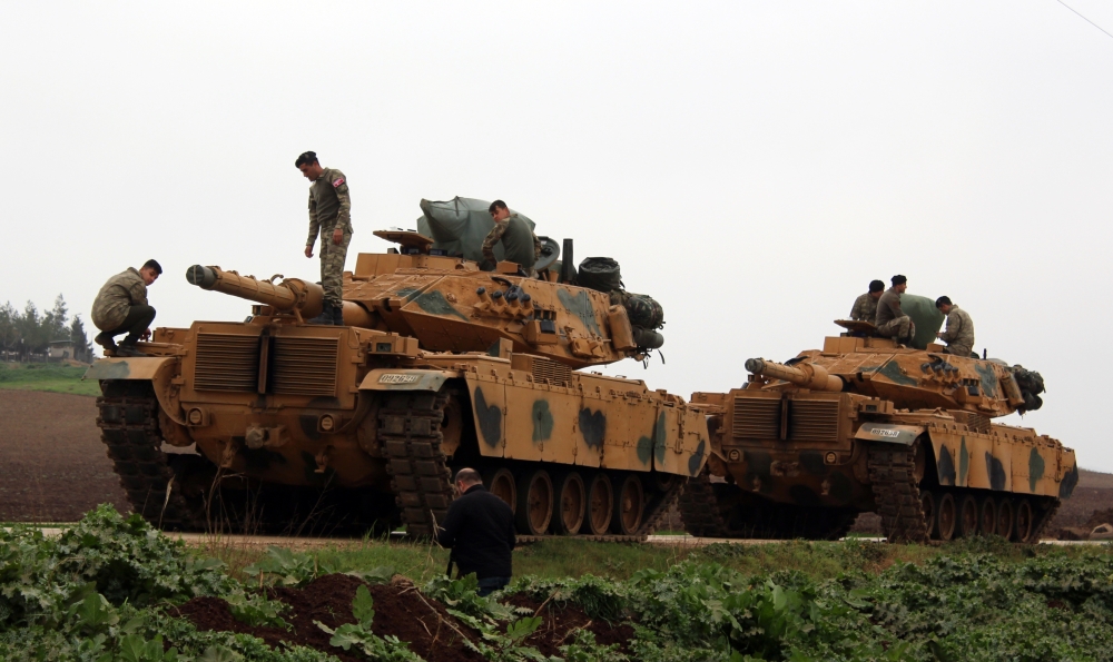 A photo taken from Turkey's Hatay province shows military vehicles are being transported to border units as Turkish Armed Forces hit PYD/PKK terror group targets within the 'Operation Olive Branch' launched in Syria's Afrin, on February 11, 2018. Hüseyin 
