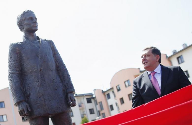 Milorad Dodik watches as a statue of Gavrilo Princip, the man who shot dead the heir to the Habsburg throne a century ago, thumbing their nose at the country’s official commemoration of the act that triggered World War One, is uncovered during an opening 