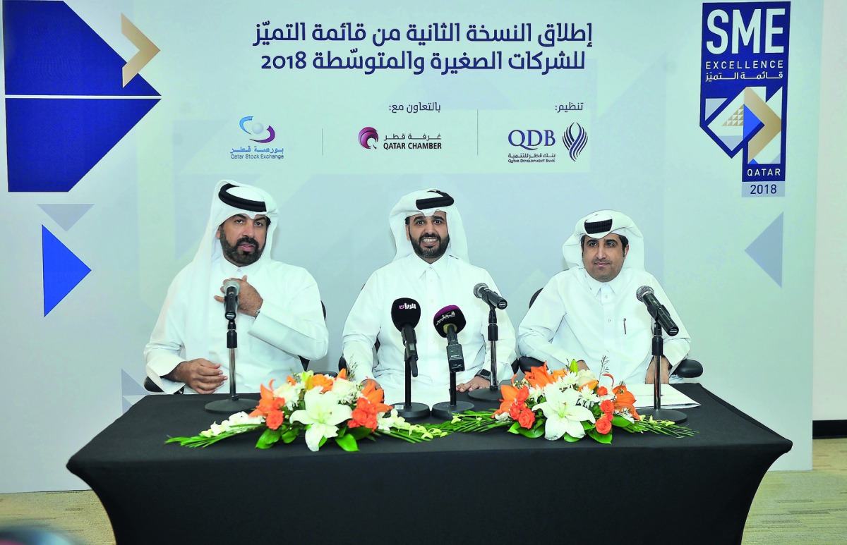 FROM LEFT: Rashid bin Ali Al Mansoori, CEO of Qatar Stock Exchange; Abdulaziz bin Nasser Al Khalifa, QDB CEO; and Saleh bin Hamad Al Sharqi, Director General of Qatar Chamber; during the press conference at QDB main office yesterday. Pic: Baher Amin/ The 