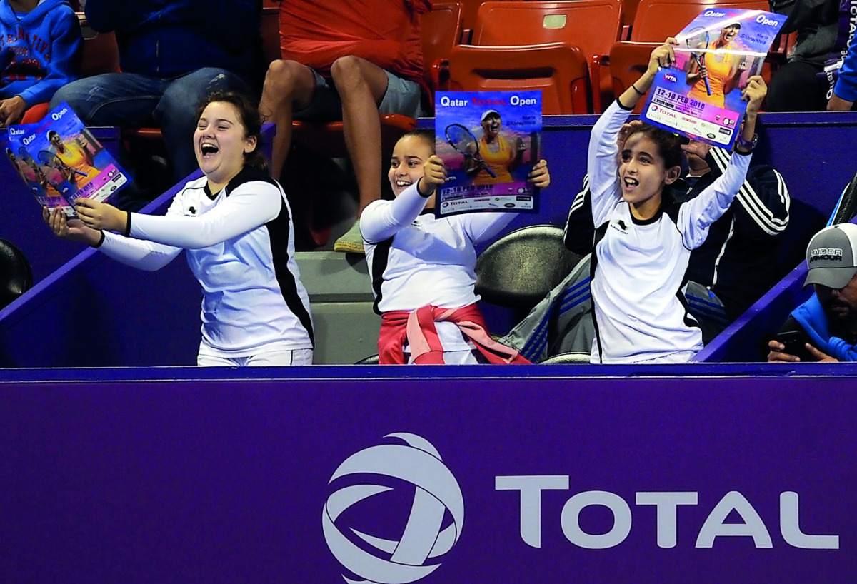 Young spectators cheer Maria Sharapova during her first round match at the Khalifa International Tennis and Squash Complex in Doha yesterday.
