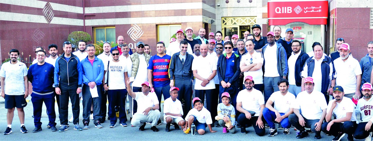 QIIB’s CEO Dr Abdulbasit Ahmad Al Shaibei and senior executive managers of the bank and staff members during the National Sport Day activities, yesterday.