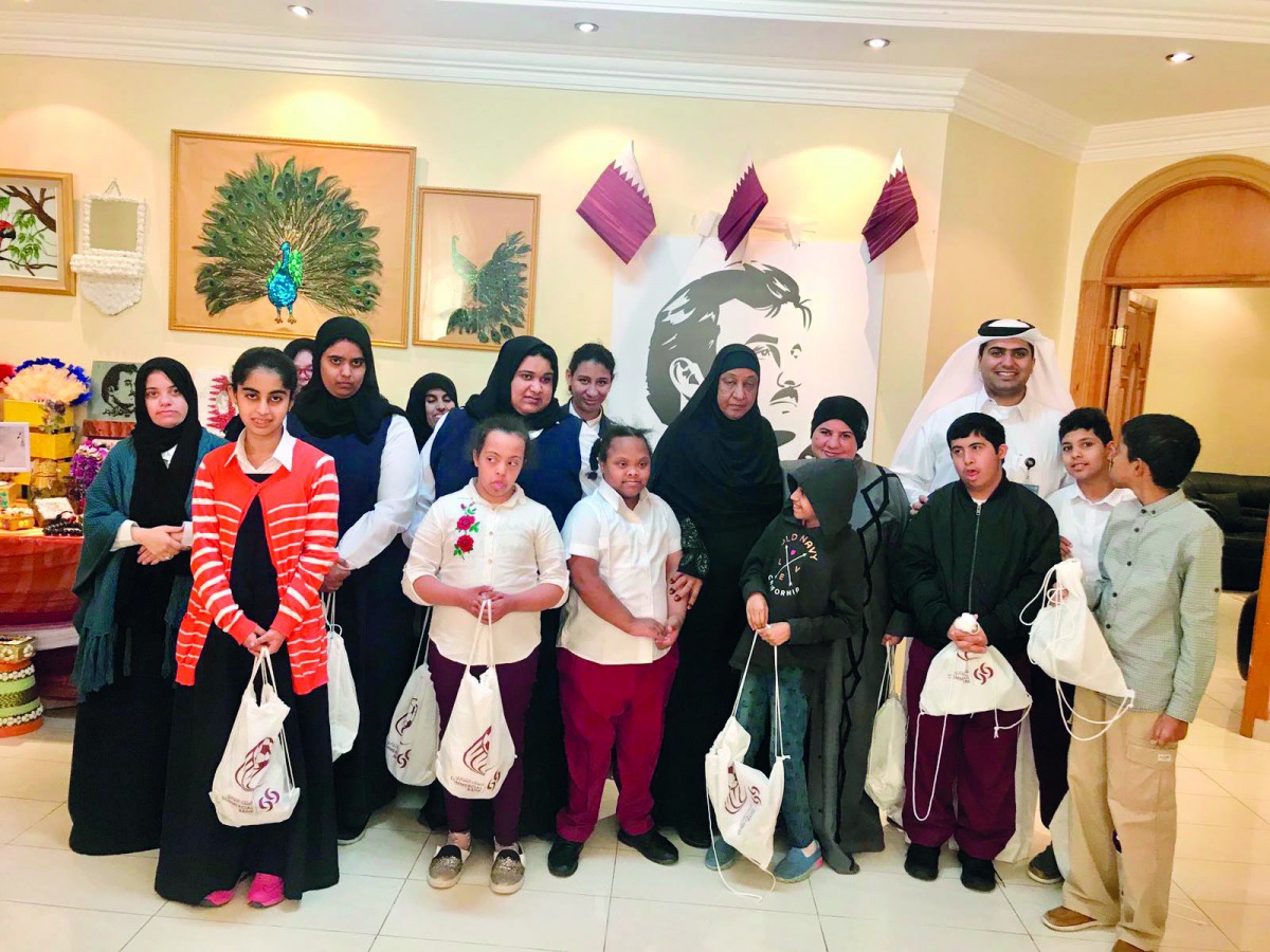 Commercial Bank officials at the Qatar Society for Rehabilitation of Special Needs.