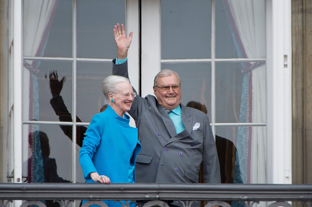 This file photo taken on April 16, 2016 shows Danish Queen Margrethe and Prince Henrik greeting well-wishers from the balcony on the occasion of the Queen's 76th Birthday celebration at Amalienborg Palace in Copenhagen. Denmark OUT / AFP / Scanpix Denmark