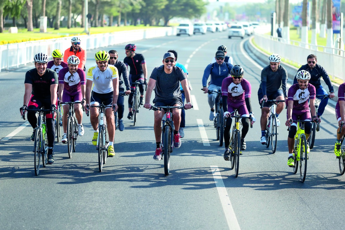 Emir H H Sheikh Tamim bin Hamad Al Thani cycling near the towers area to mark Qatar’s National Sport Day, yesterday.