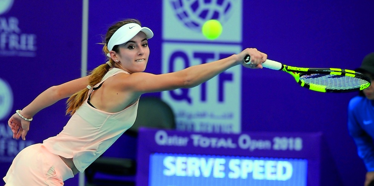 CiCi Belis of USA returns the ball to Czech Karolina Pliskova during their match in the Qatar Total Open 2018 at the Khalifa Tennis and Squash Complex in Doha yesterday. Pic: Salim Matramkot/The Peninsula