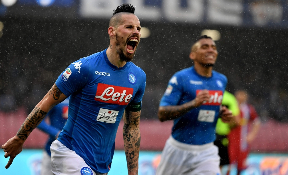 Napoli's Slovakian midfielder Marek Hamsik celebrates after scoring a goal before it is disallowed due to offside during the Serie A football match between Napoli and Spal at San Paolo Stadium Stadium in Naples on February 18, 2018. / AFP / TIZIANA FABI