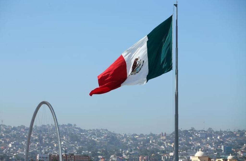 File photo of a Mexican flag seen over the city of Tijuana, Mexico from San Ysidro, a district of San Diego, California, US, April 21, 2017. REUTERS/Mike Blake