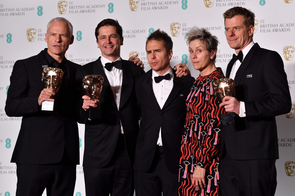 British-Irish filmmaker Martin McDonagh (L), producer Peter Czernin (2L), supporting actor award winner US actor Sam Rockwell, and British producer Graham Broadbent (R) pose with leading actress award winner US actress Frances McDormand (2R) after receivi