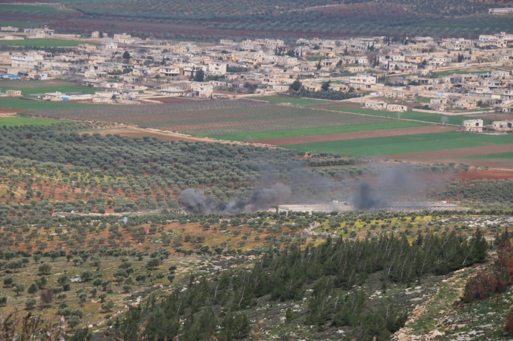 Smoke rises after a tank of Turkish Armed Forces fired to the positions of PYD/PKK  in Afrin town of Syria, on February 19, 2018. Mahmud Faysal - Anadolu 