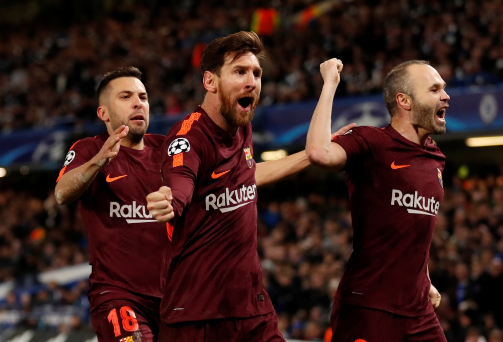 Barcelona’s Lionel Messi celebrates scoring their first goal with Andres Iniesta (R) and Jordi Alba (L) Action Images via Reuters/Andrew Boyers