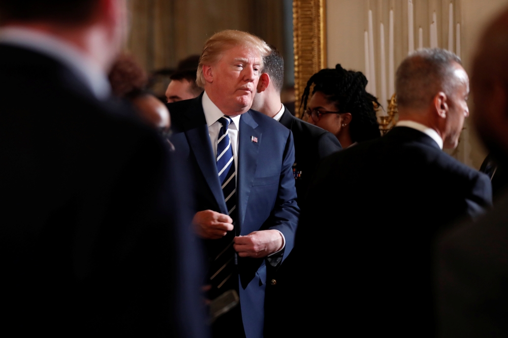 U.S. President Donald Trump departs after a listening session with Marjory Stoneman Douglas High School shooting survivors and students at the White House in Washington, U.S., February 21, 2018. REUTERS/Jonathan Ernst