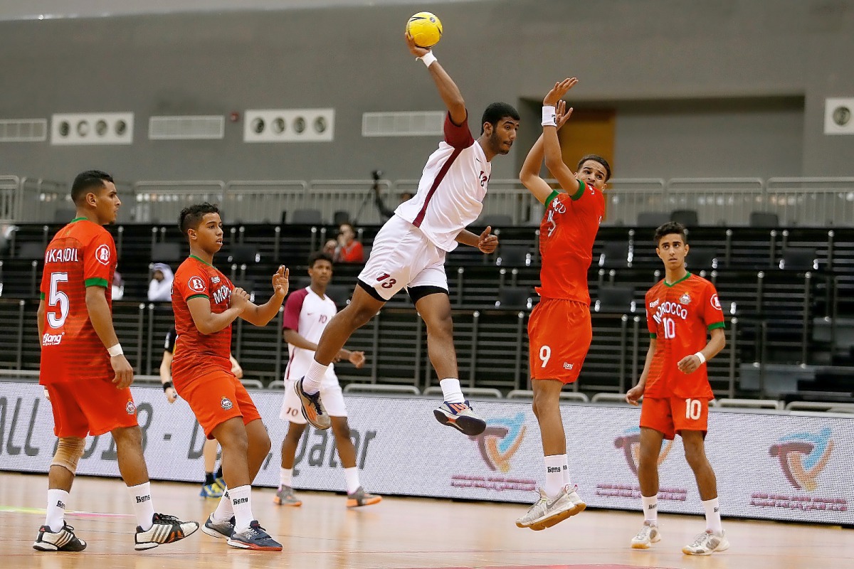 A Qatari player shoots to score during their opening fixture of the 24th ISF World Schools Handball Championships  against Morocco at the Ali bin Hamad Al Attiyah Stadium in Al Sadd yesterday. 
