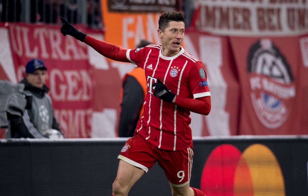 Bayern Munich's Polish forward Robert Lewandowski celebates afer he scored a goal during the UEFA Champions League round of sixteen first leg football match Bayern Munich vs Besiktas Istanbul on February 20, 2018 in Munich, southern Germany. AFP / Sven Ho