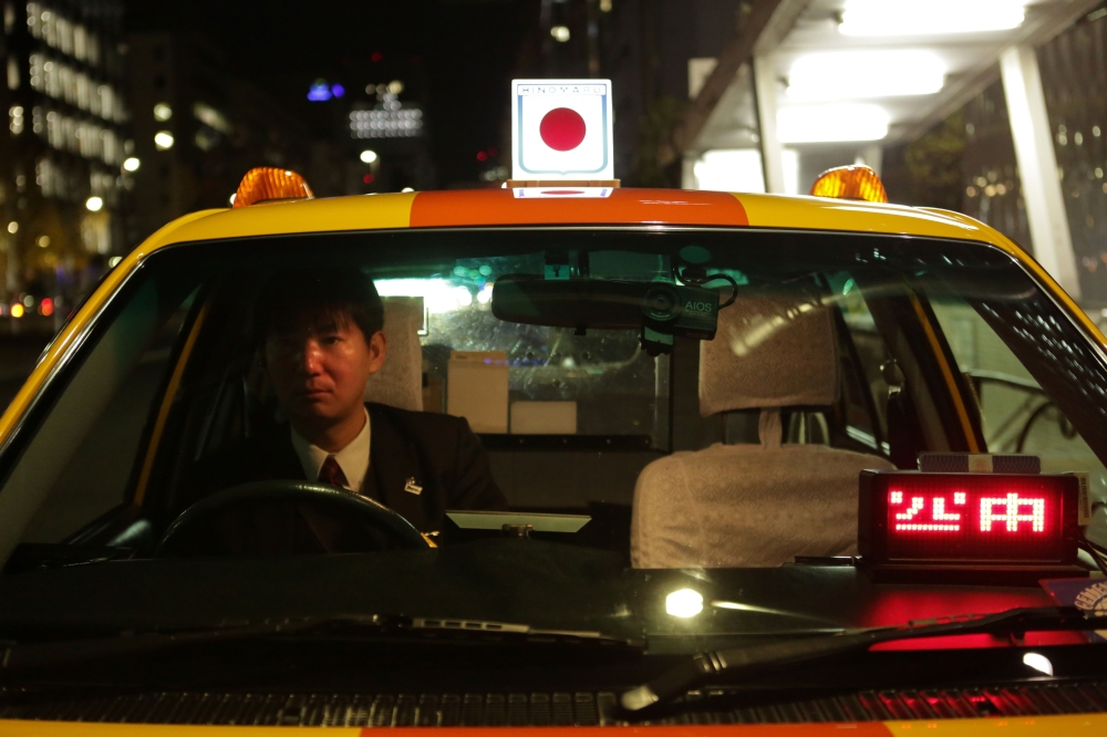 AFP file photo for representational purposes only showing a Japanese taxi driver in wait.