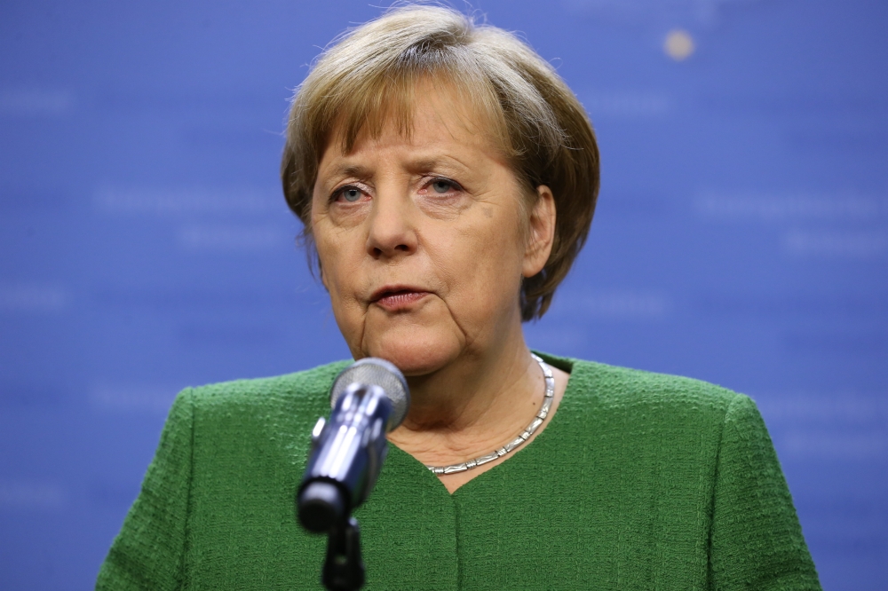 German Chancellor Angela Merkel gives a statement to the media after the informal meeting of the 27 European Heads of States and Governments in Brussels, Belgium, 23 February 2018. Dursun Aydemir - Anadolu 
