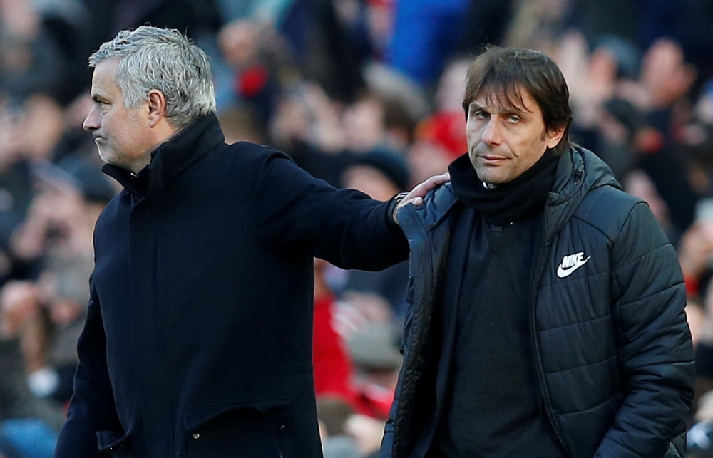Manchester United manager Jose Mourinho with Chelsea manager Antonio Conte after the match REUTERS/Andrew Yates 
