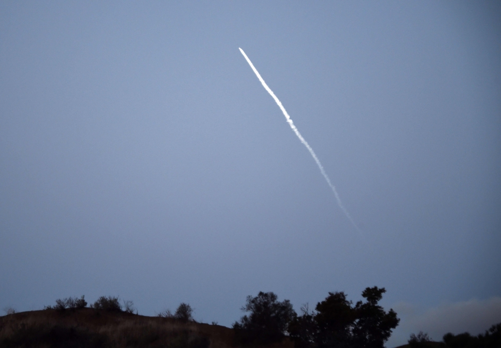 SpaceX flies in the distance after it made its fourth attempt at launching a Falcon 9 satellite-carrying rocket from Vandenberg Air Force Base, California at 6:17 a.m.ET on February 22, 2018. / AFP / Robyn Beck 