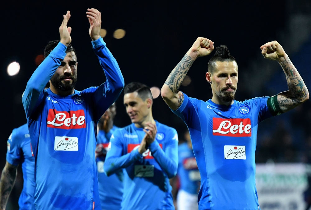 Napoli's Spanish defender Raul Albiol (L) and Napoli's Slovakian midfielder Marek Hamsik celebrates at the end of the Italian Serie A football match Cagliari vs Napoli on February 26, 2018 at Sardinia stadium in Cagliari. / AFP / ALBERTO PIZZOLI