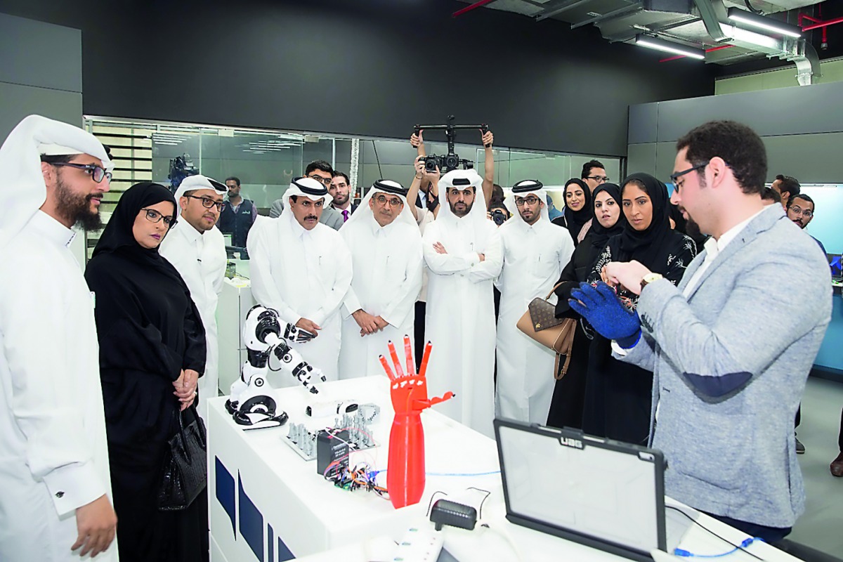 H E Sheikh Abdullah bin Saoud Al Thani (third left), Governor of Qatar Central Bank and Chairman of QDB; along with Abdulaziz bin Nasser Al Khalifa (fifth left) QDB CEO and QBIC Chairman and other officials being briefed about QBIC’s ‘Fab Lab’ facilities,