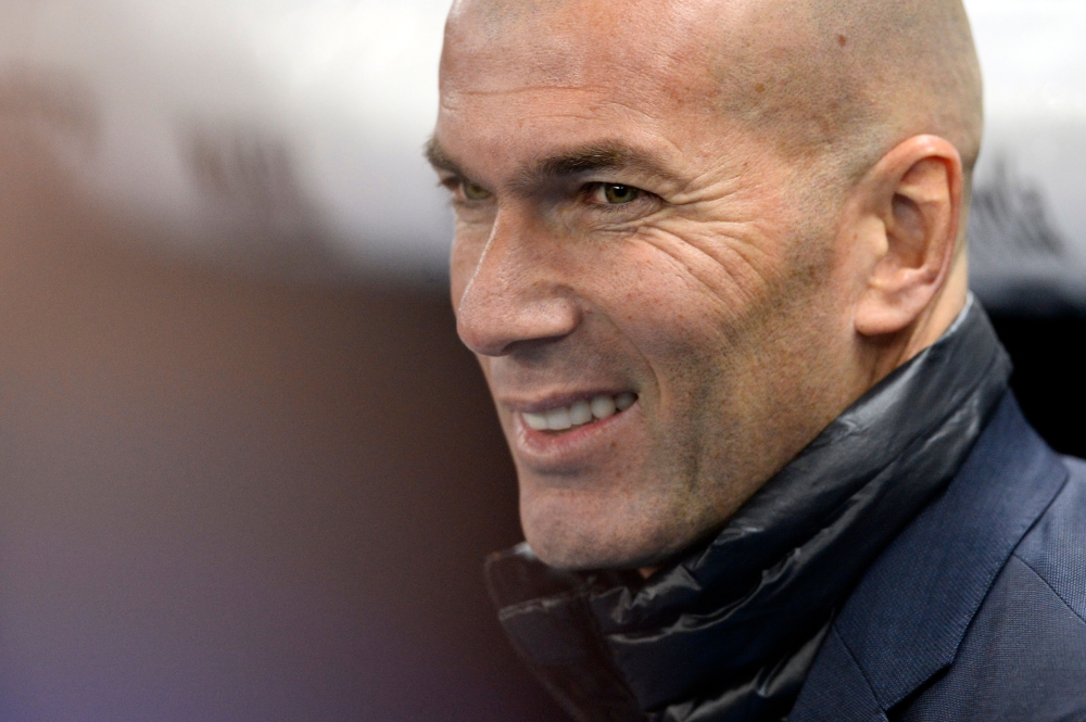 Real Madrid's French coach Zinedine Zidane smiles before the Spanish league football match between RCD Espanyol and Real Madrid CF at the RCDE Stadium in Cornella de Llobregat on February 27, 2018. AFP / Josep Lago