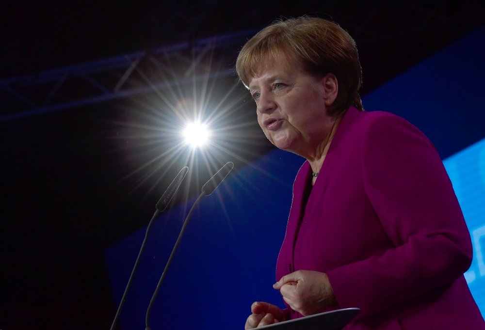 (FILES) This file photo taken on February 26, 2018 shows German Chancellor Angela Merkel as she gives a speech during her conservative Christian Democratic Union (CDU) party's congress in Berlin.  AFP / Tobias SCHWARZ
